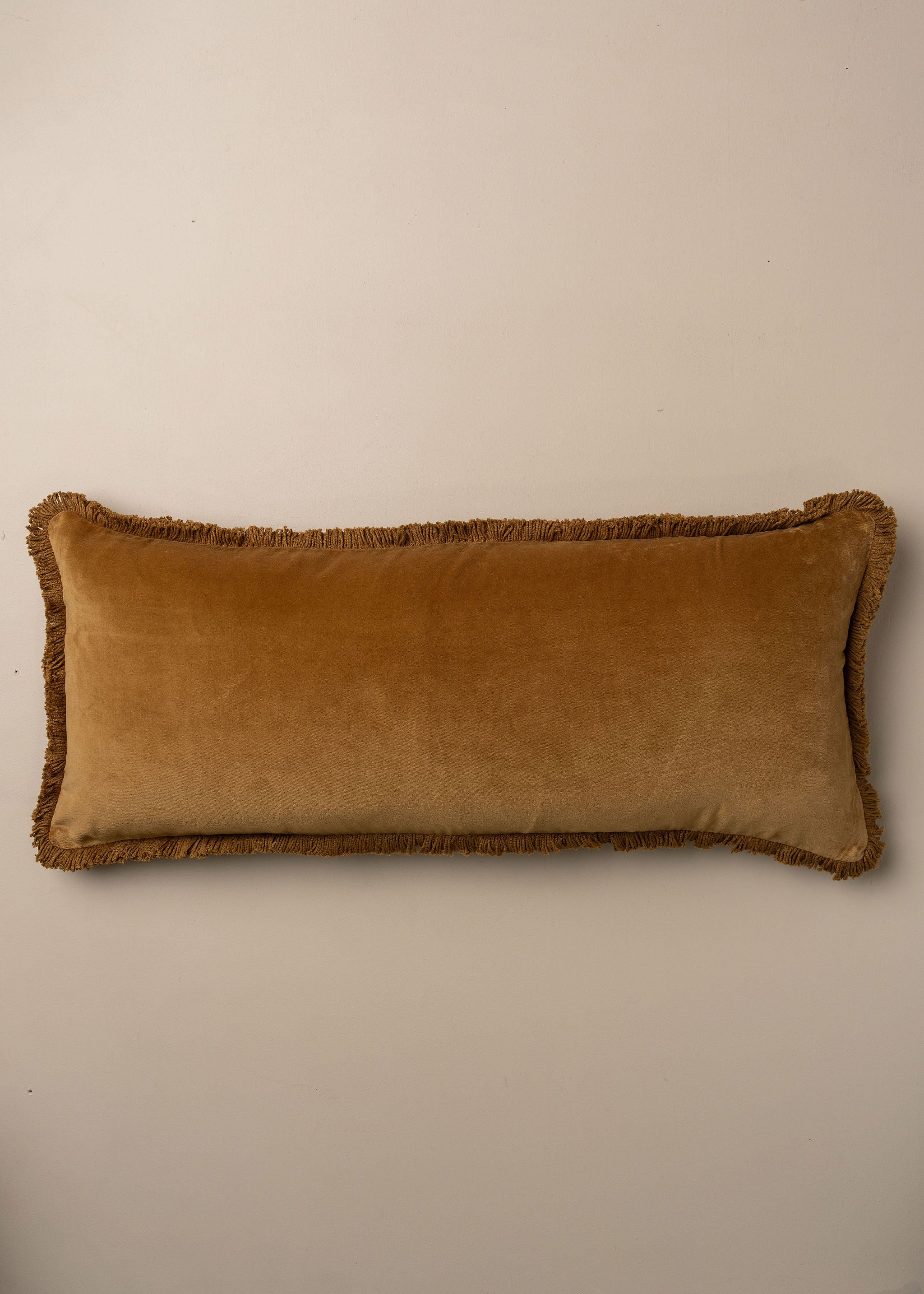 Velvet Bolster Fringed Cushion | Nutmeg - - - Saardé - Saardé.